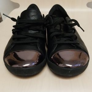 Black sneakers with rose gold metallic toe cap